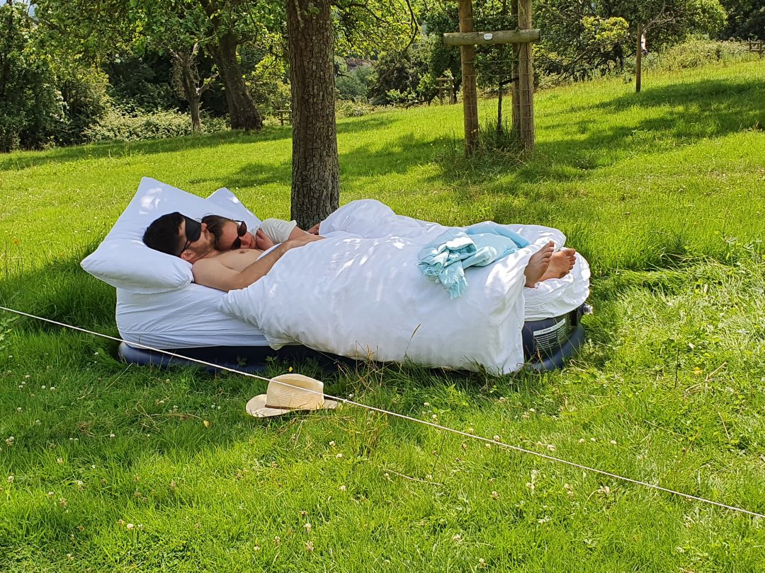 Guests sleeping off the night before in the orchard